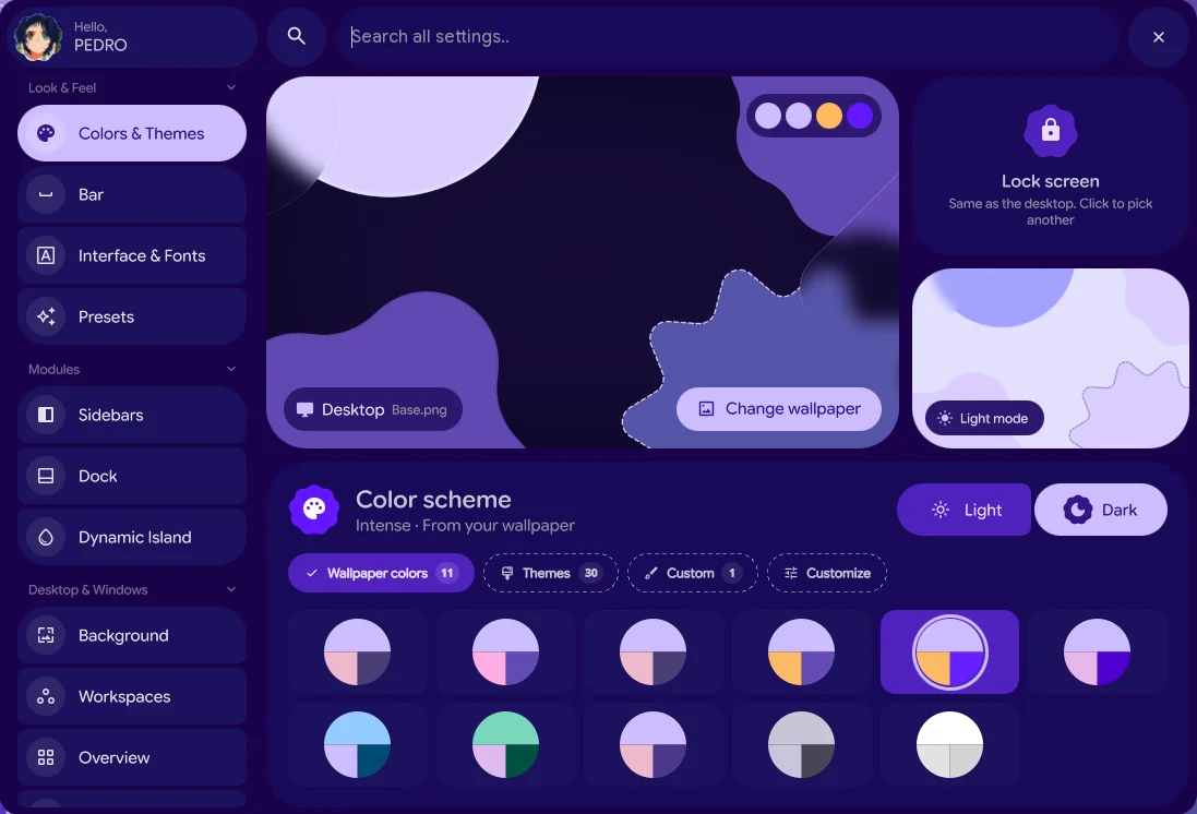 The Settings app on Colors and Themes: desktop and lock screen wallpapers, light and dark mode and the wallpaper color schemes.